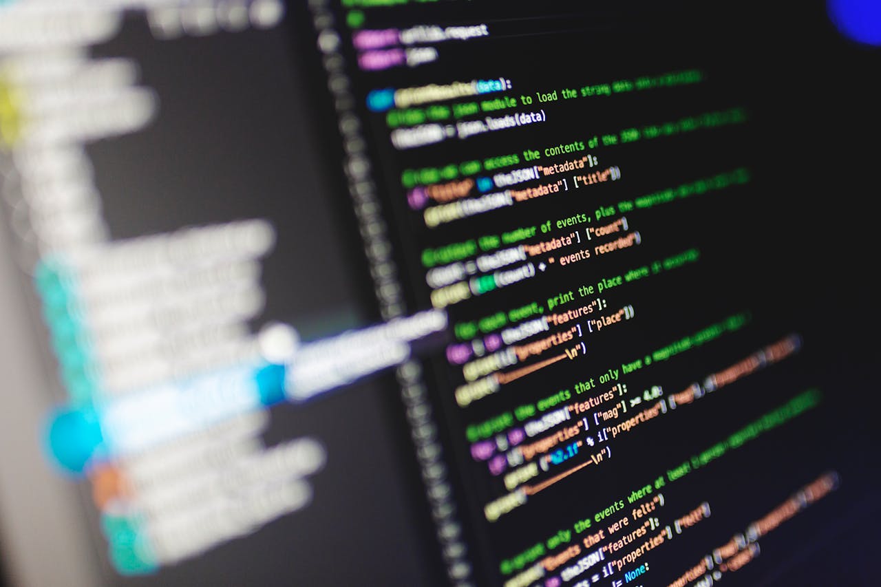 team-04 Close-up of a computer screen displaying colorful programming code in JavaScript.